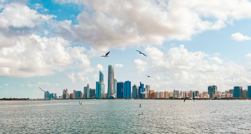 Abu Dhabi Corniche waterfront skyline with birds