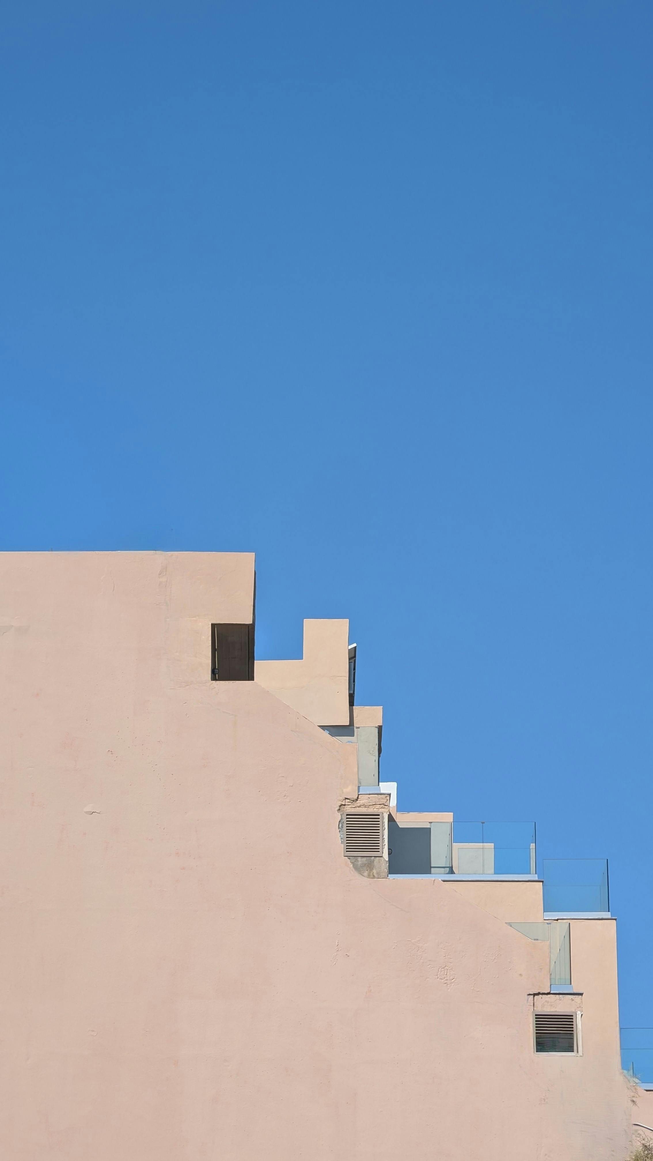 a building with a blue sky in the background