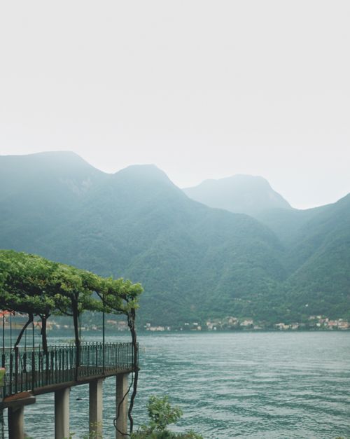 Free Scenic view of Lake Como in Nesso, Italy with lush mountains and serene water. Stock Photo