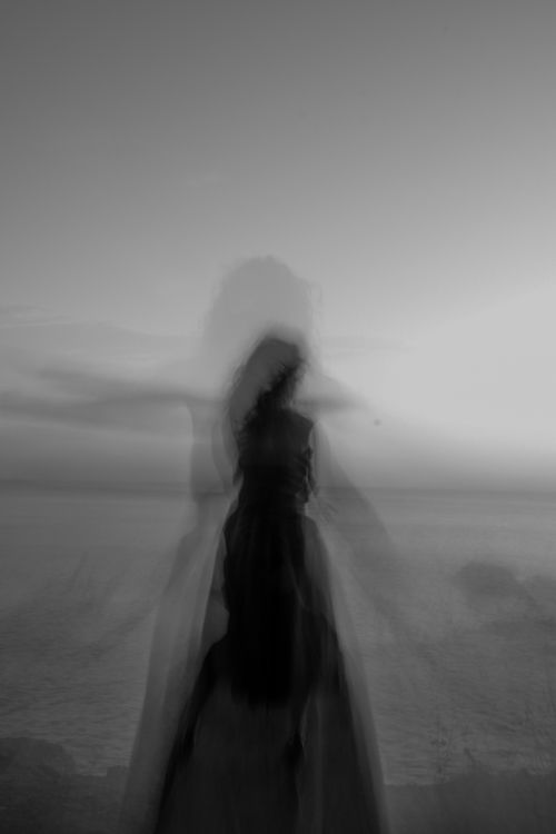 Free A ghostly silhouette of a woman in black and white, capturing a mystical scene on Kınalıada beach in Türkiye. Stock Photo