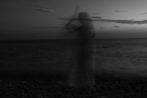 Free Blurred ghostly silhouette on a serene beach at twilight in Kınalıada, Istanbul. Stock Photo