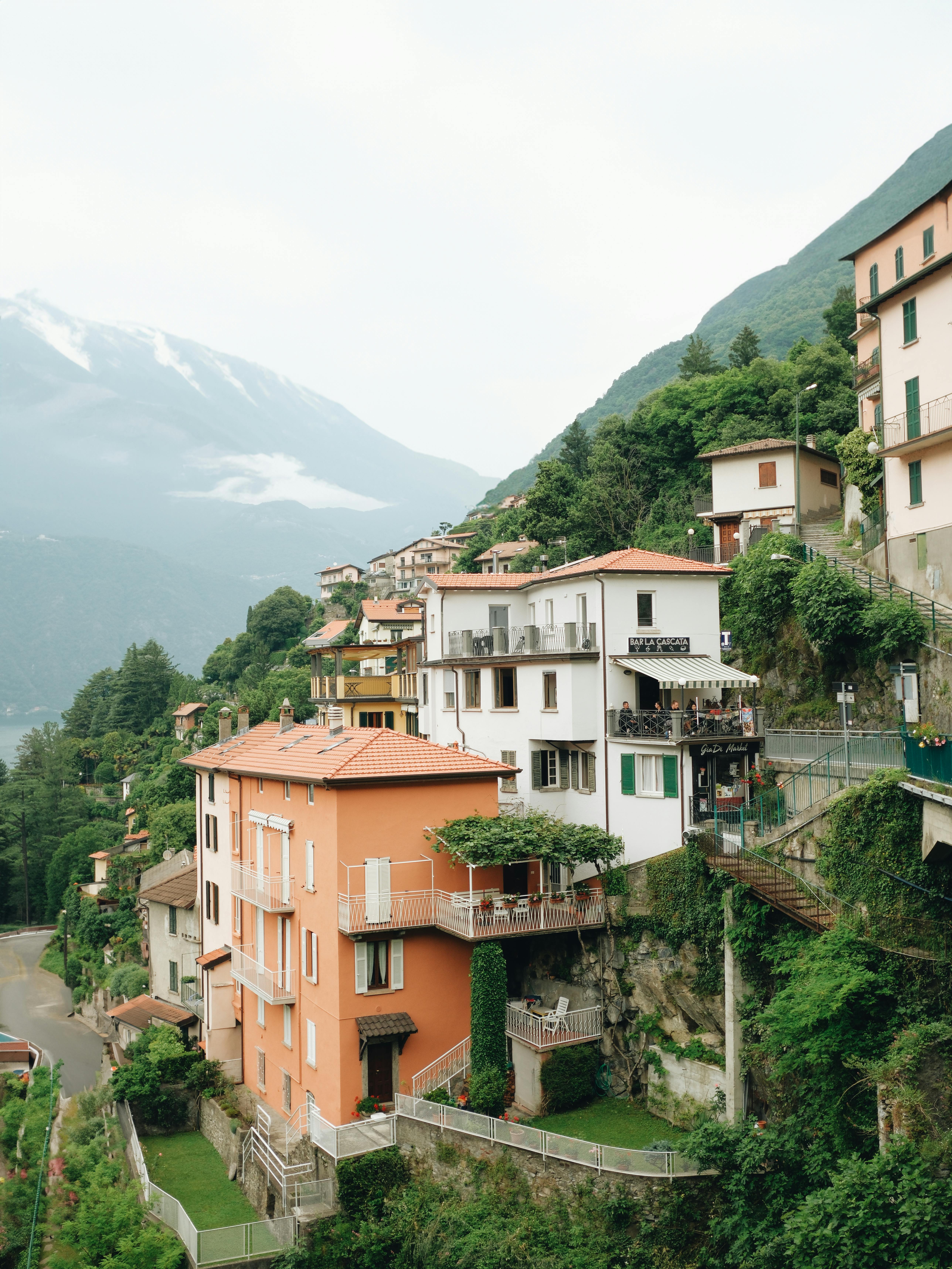 Free Scenic view of colorful hillside villas in Nesso, Italy overlooking Lake Como. Stock Photo