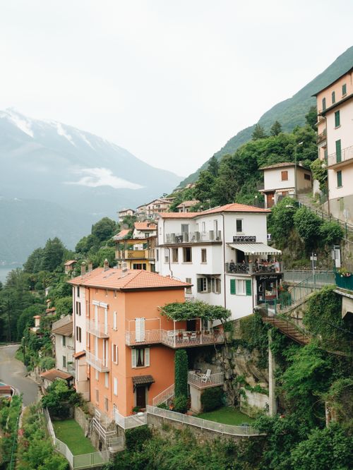 Free Scenic view of colorful hillside villas in Nesso, Italy overlooking Lake Como. Stock Photo