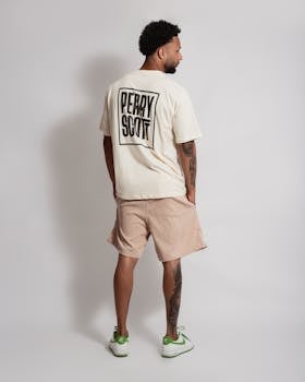 Casual urban portrait of a man in streetwear, showcasing a fashionable look.