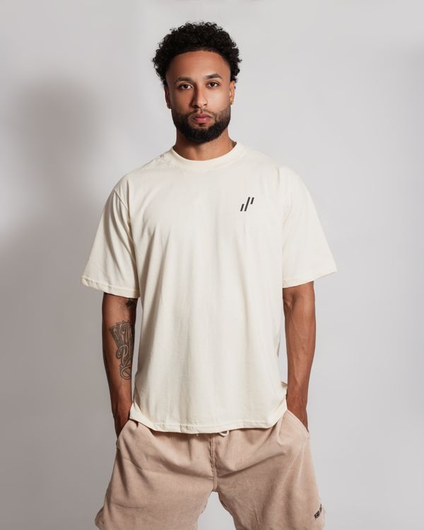 A man in a white t - shirt and black shorts · Free Stock Photo