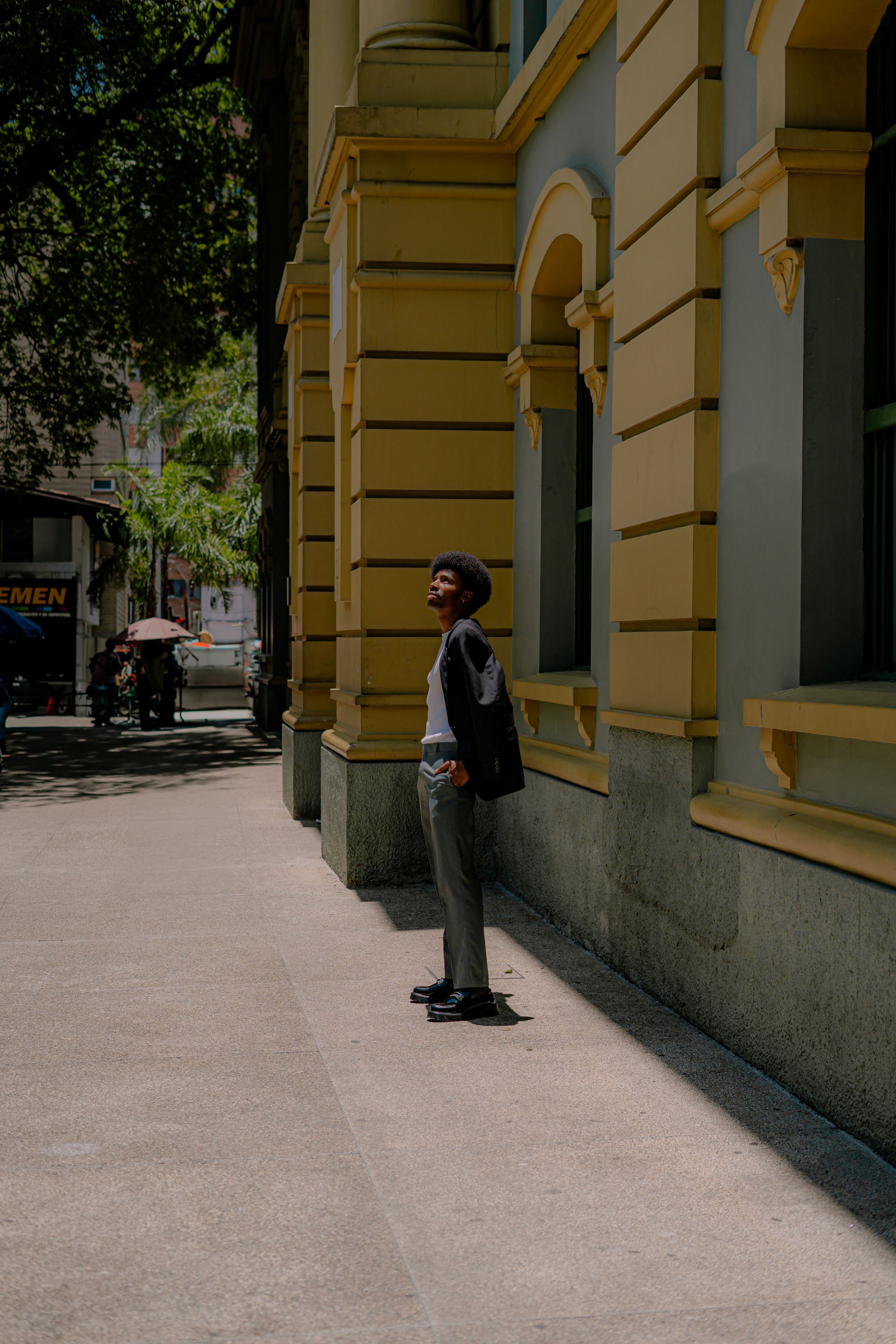 Urban Scene with Man by Historic Building · Free Stock Photo