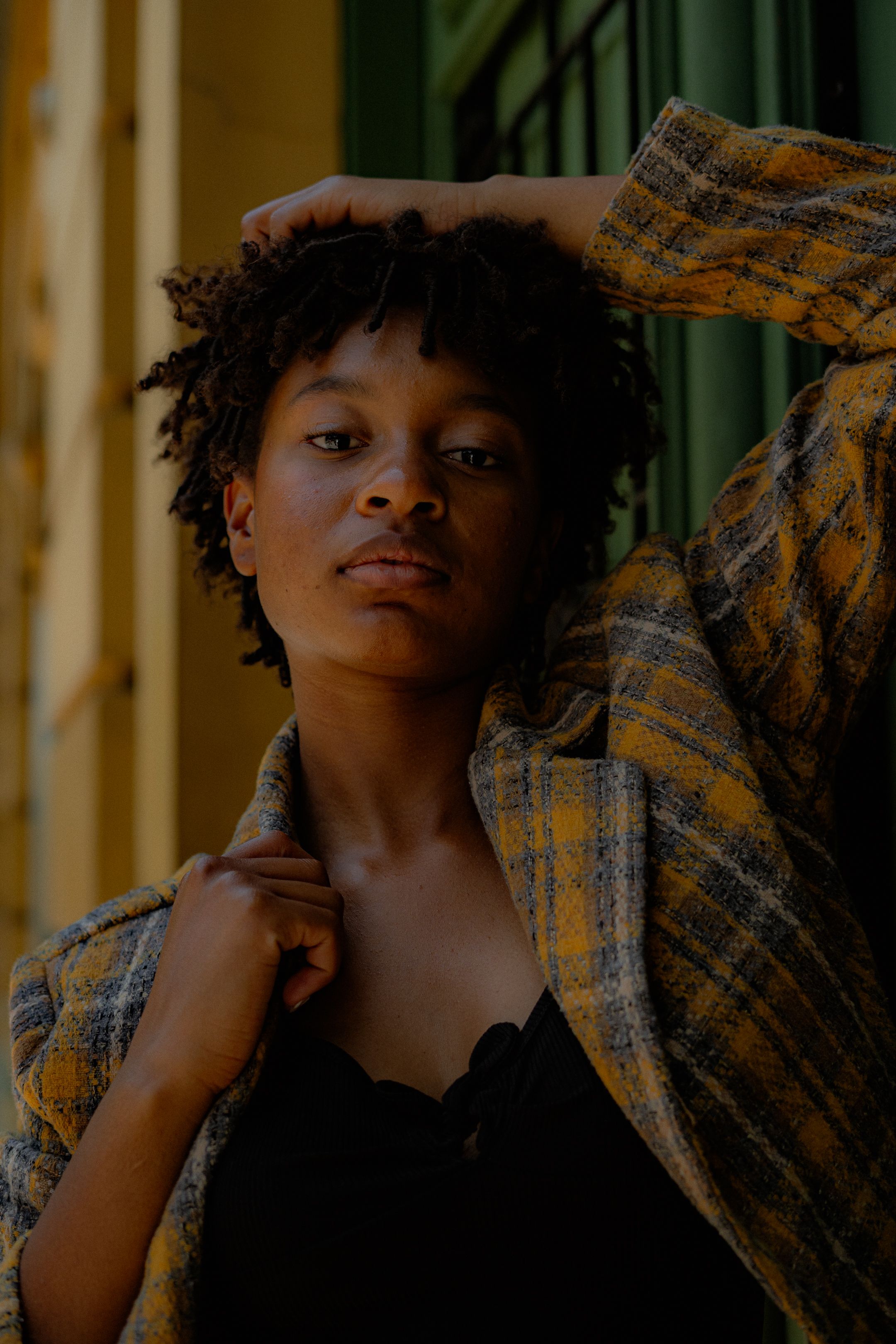 Confident woman in stylish attire, capturing urban fashion essence outdoors.