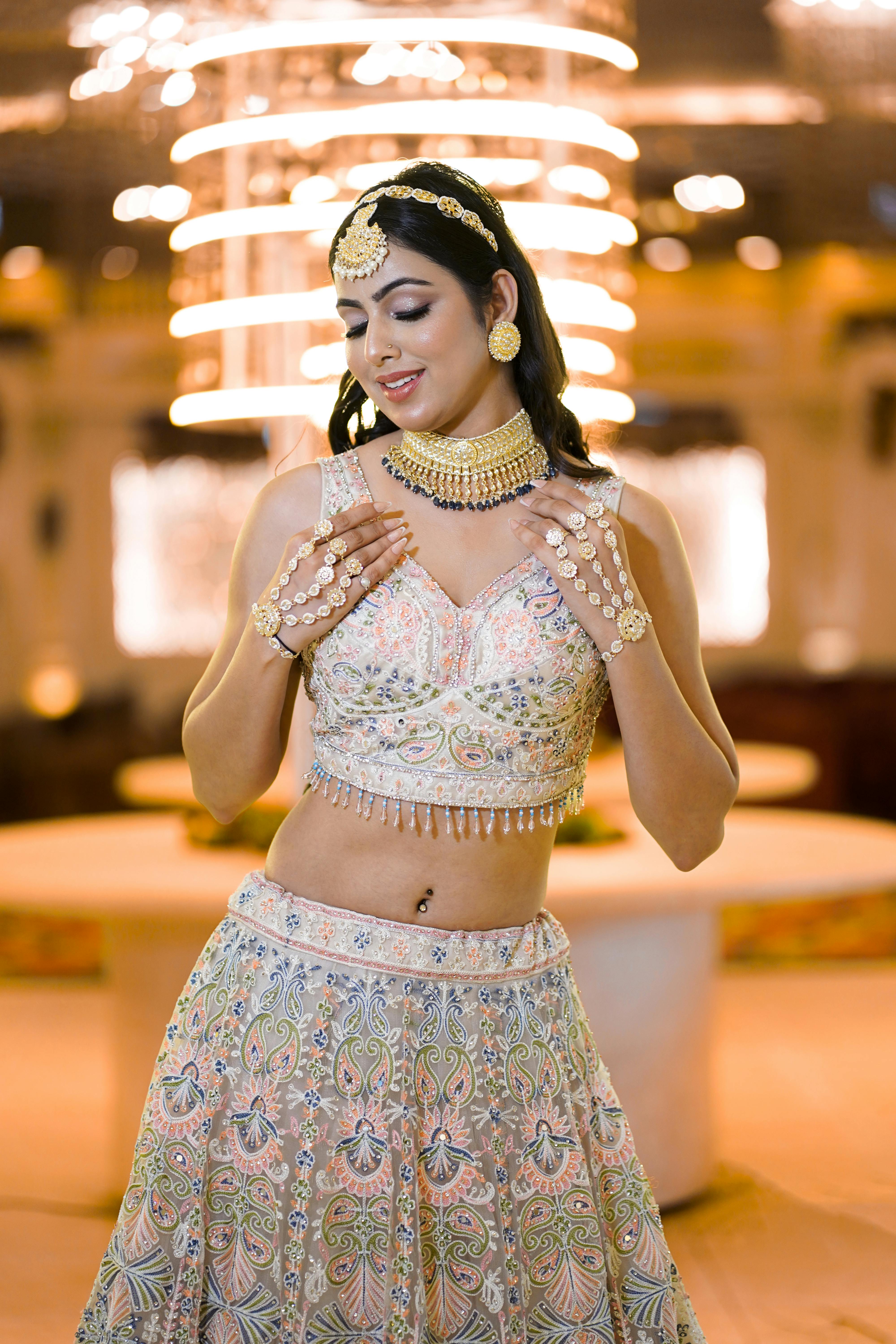 Beautiful Indian woman in traditional bridal outfit, showcasing elegance and grace.