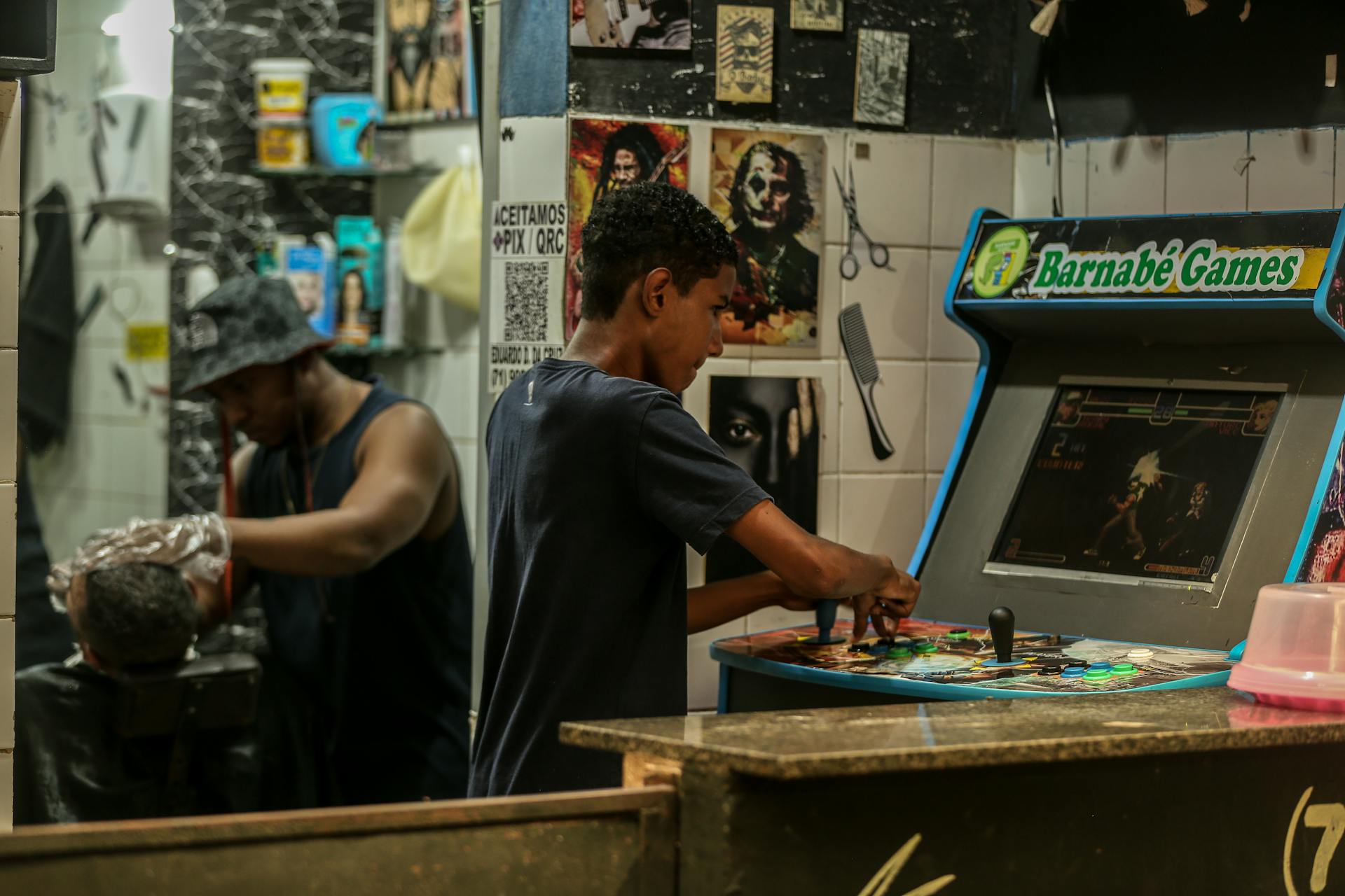 A man is working on a video game machine