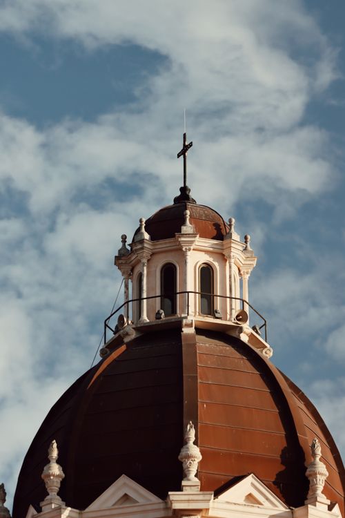Free Majestic architectural dome of the Sacred Heart Cathedral in Cagliari, Sardegna, Italy, against a cloudy sky. Stock Photo