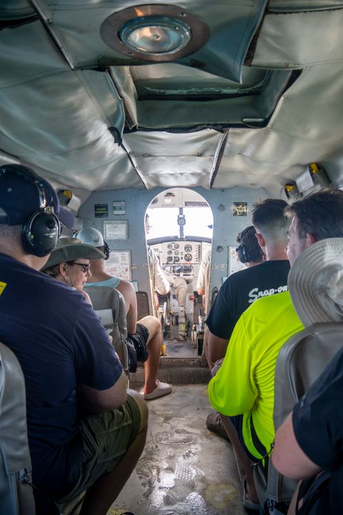 Free Interior view of a small passenger aircraft with several people heading towards Key West. Stock Photo