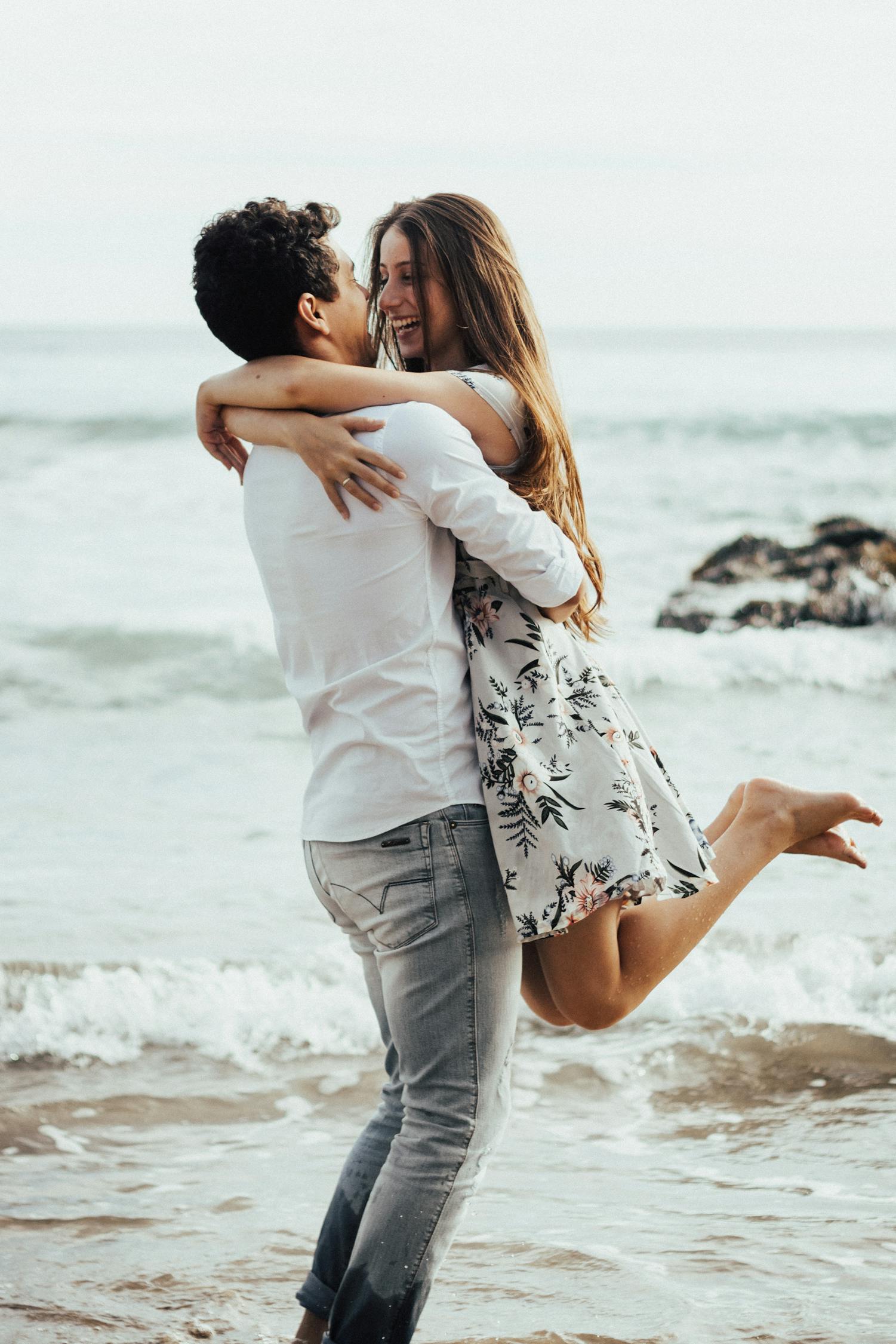 https://www.pexels.com/photo/photo-of-a-man-lifting-woman-near-body-of-water-2808658/