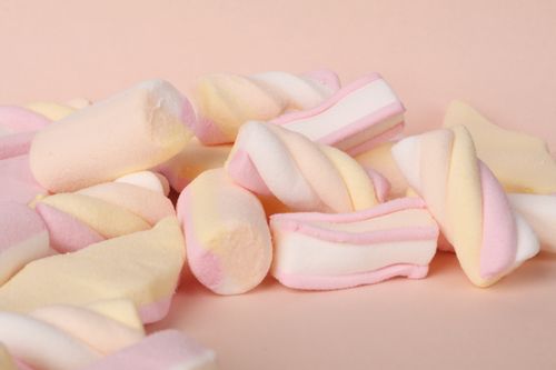 Free Delicious pastel marshmallows piled up in a soft, light setting, perfect for candy lovers. Stock Photo