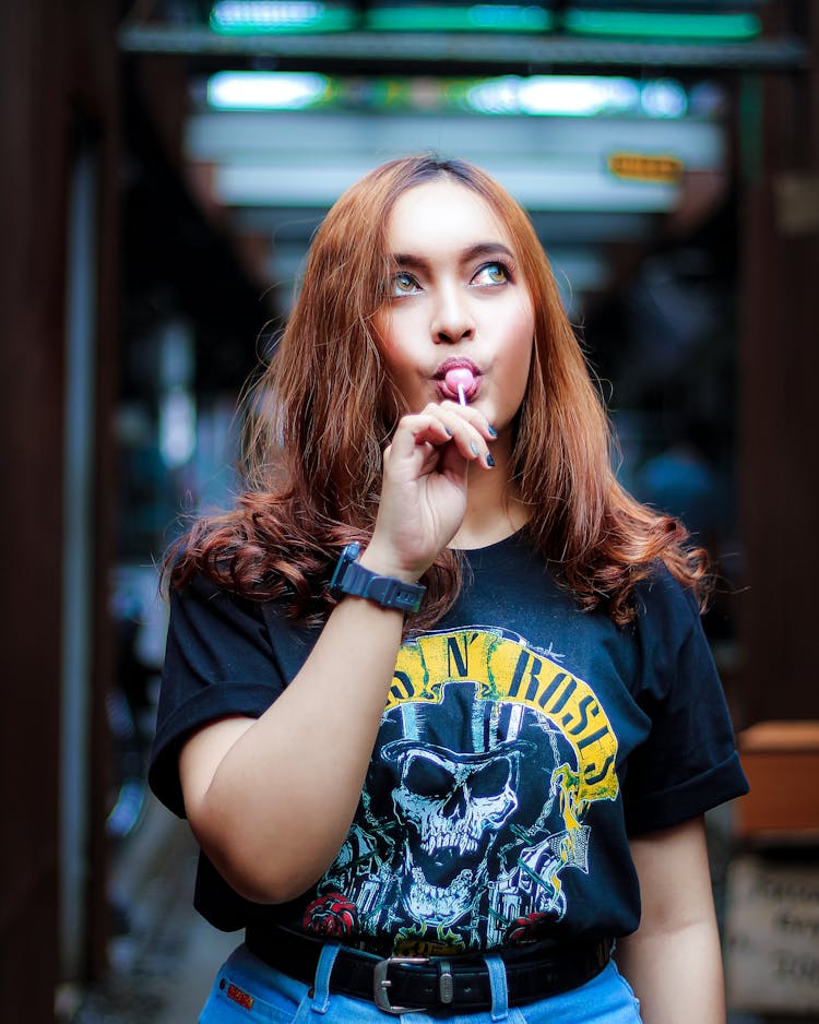 Photo Of Woman Eating Lollipop