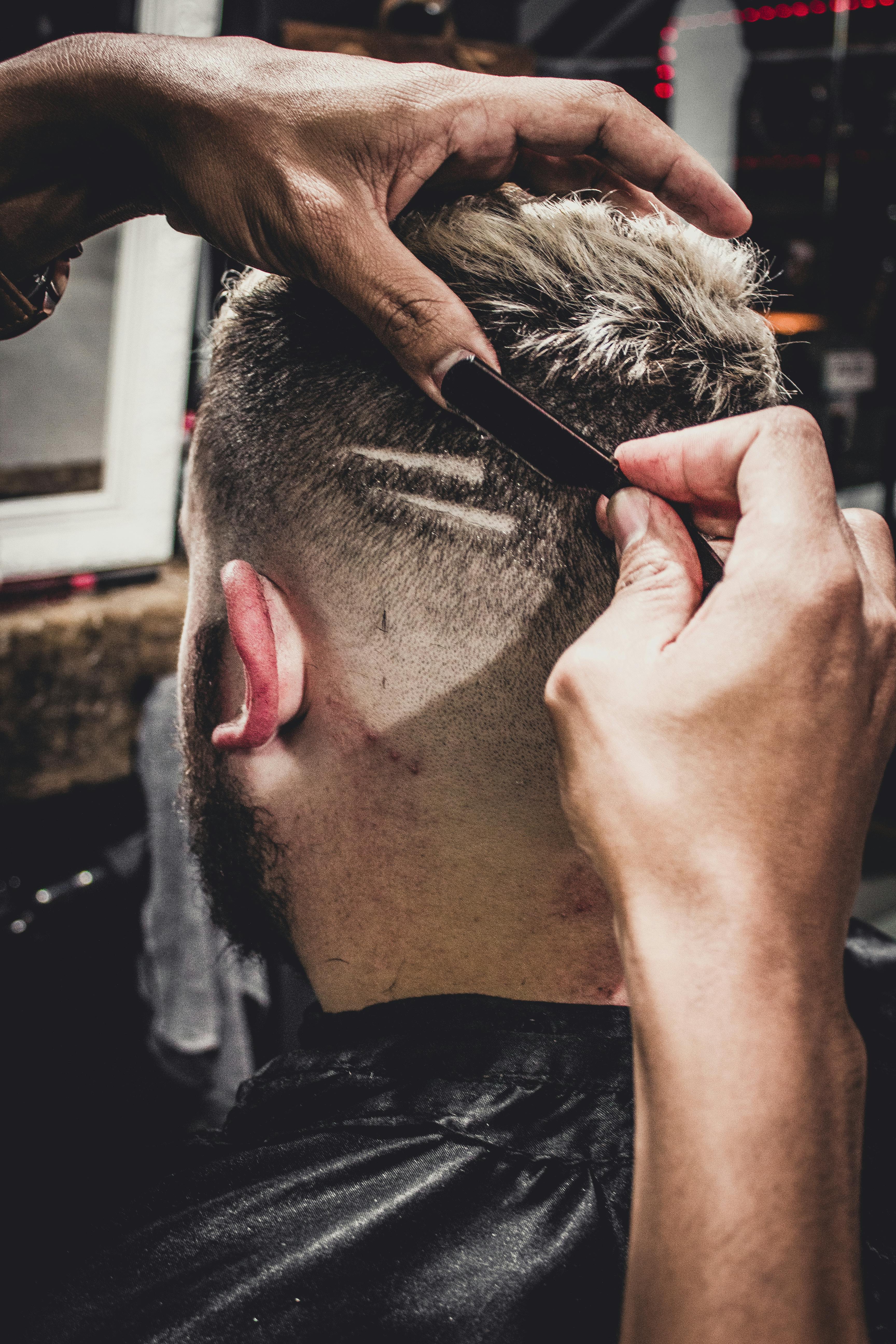 Man Having a Hair Cut Inside Shop · Free Stock Photo