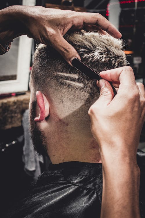 Man Having a Hair Cut Inside Shop
