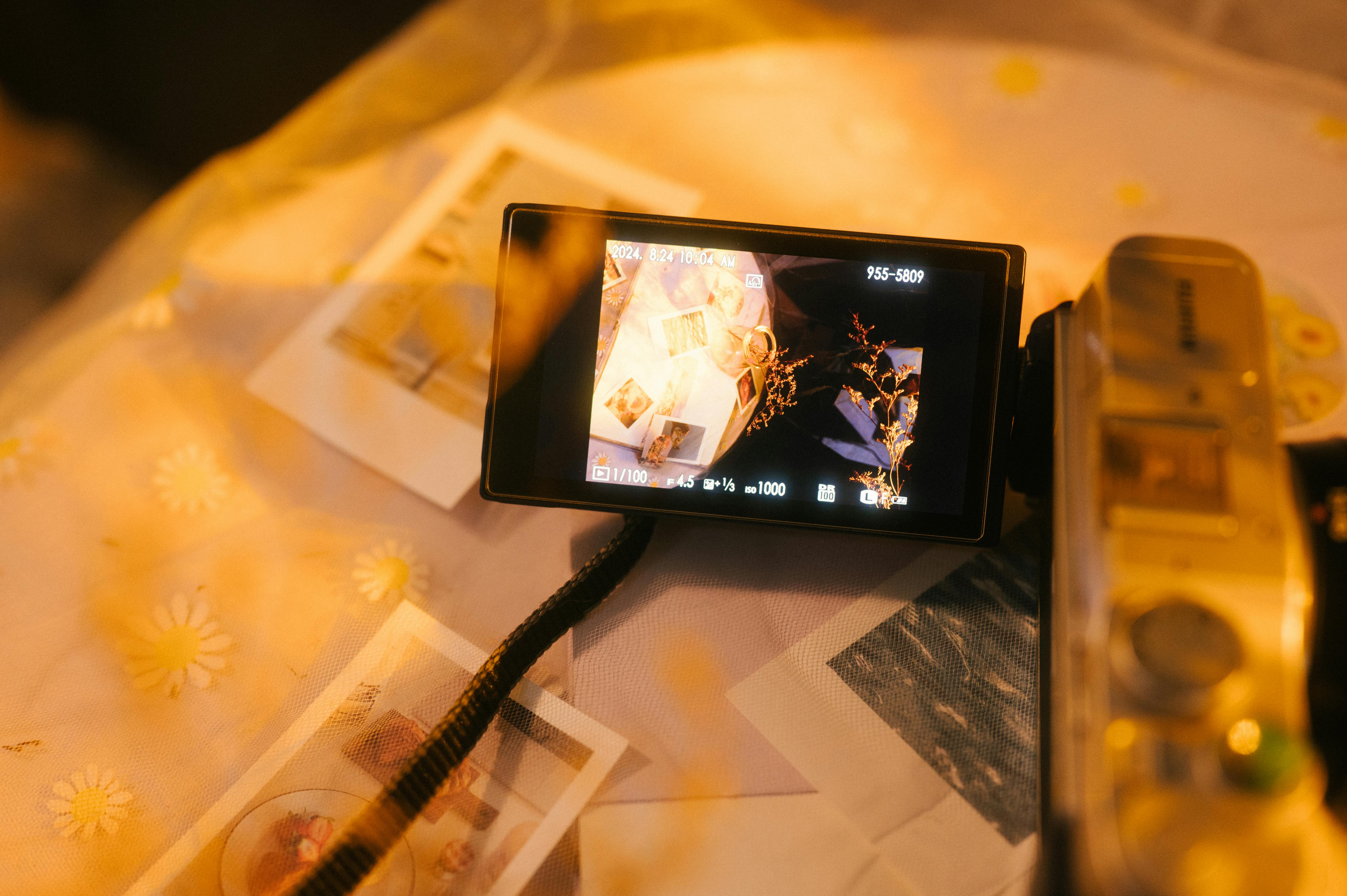 a camera is on a table with a photo on it