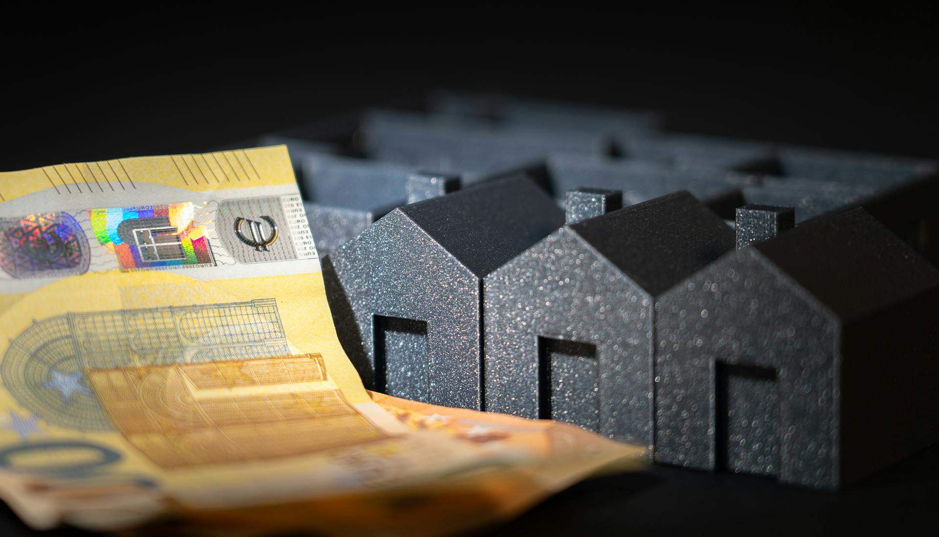 Housing estate model. Business finance cash banknotes. Euro currency.