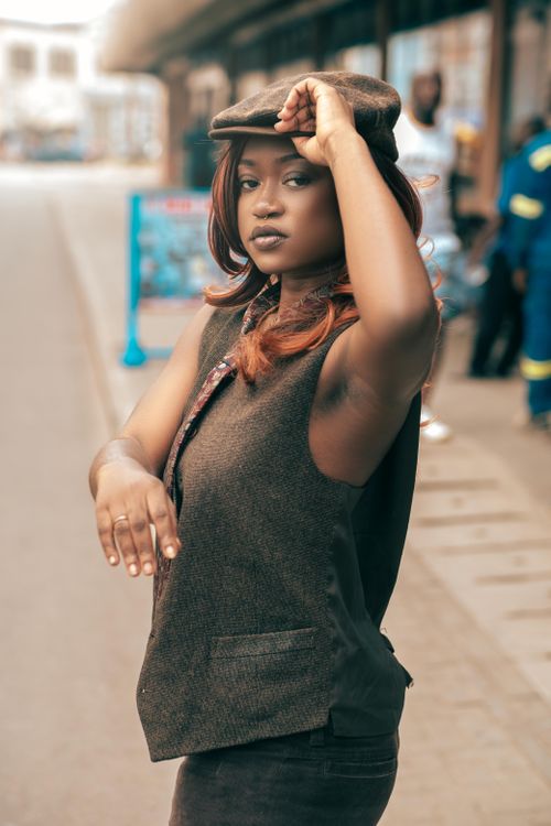 Free Chic portrait of a young woman showcasing bold fashion in Kumasi, Ghana. Stock Photo