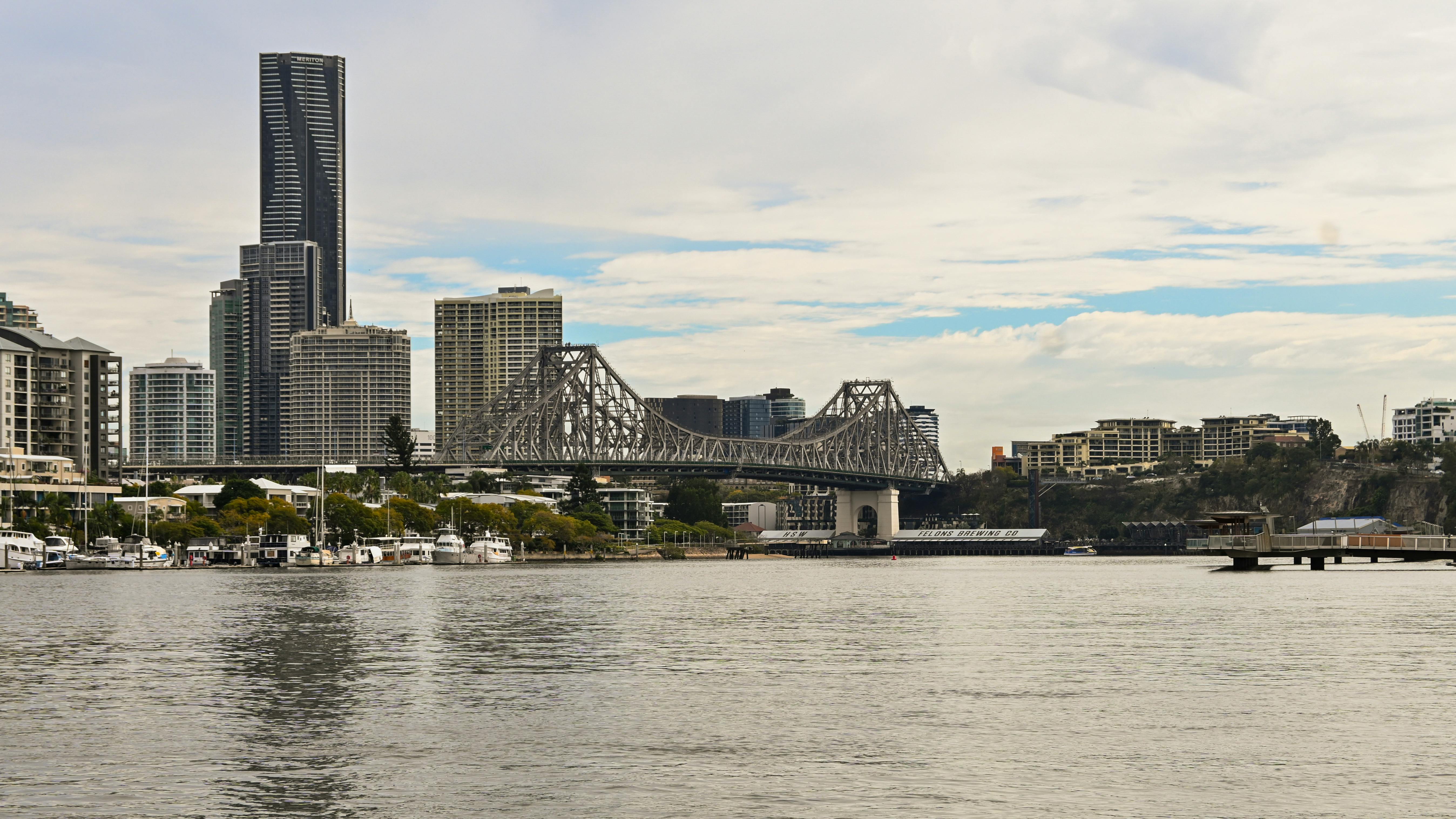 a view of a city skyline with a bridge in the background