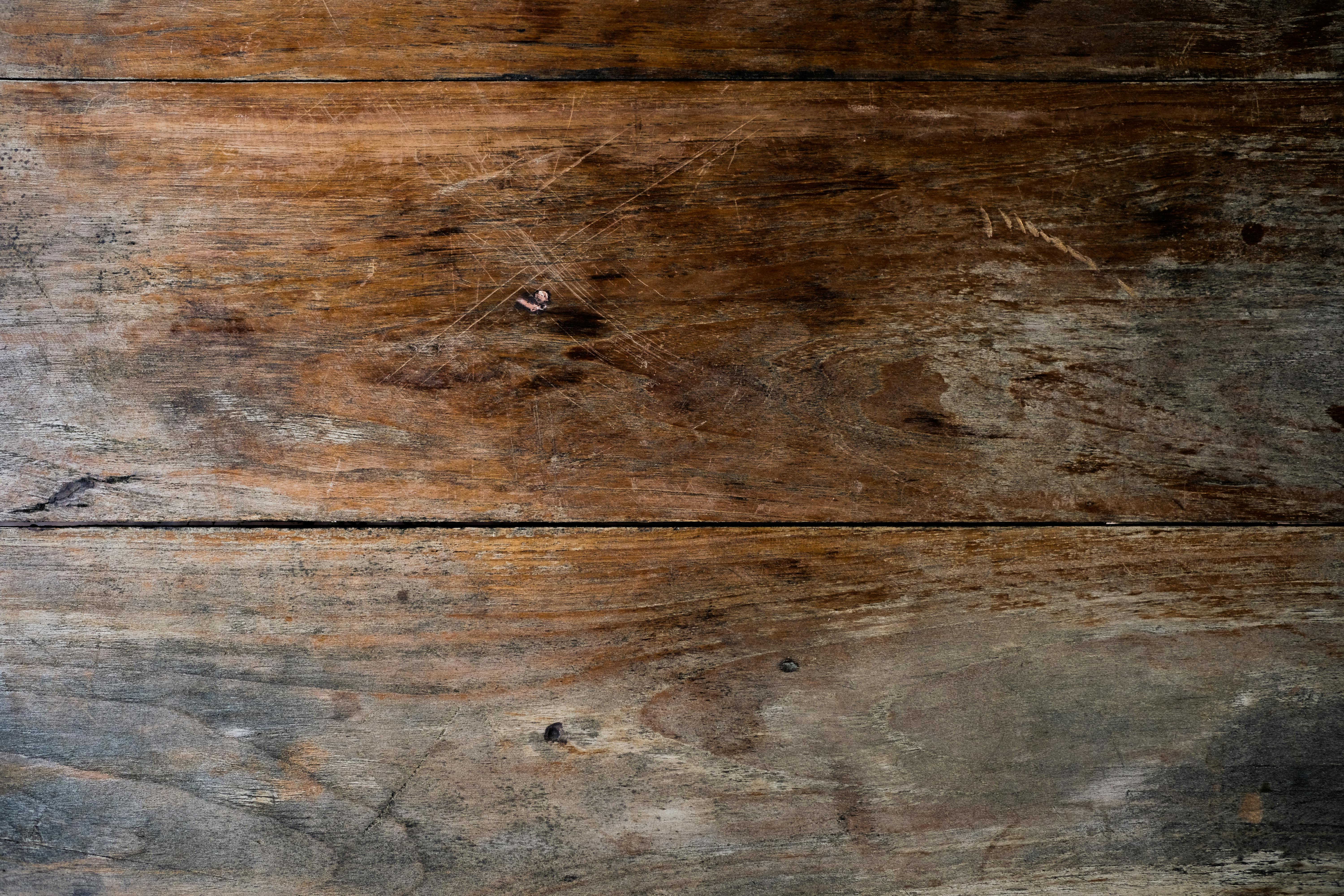 an old wooden table with some scratches