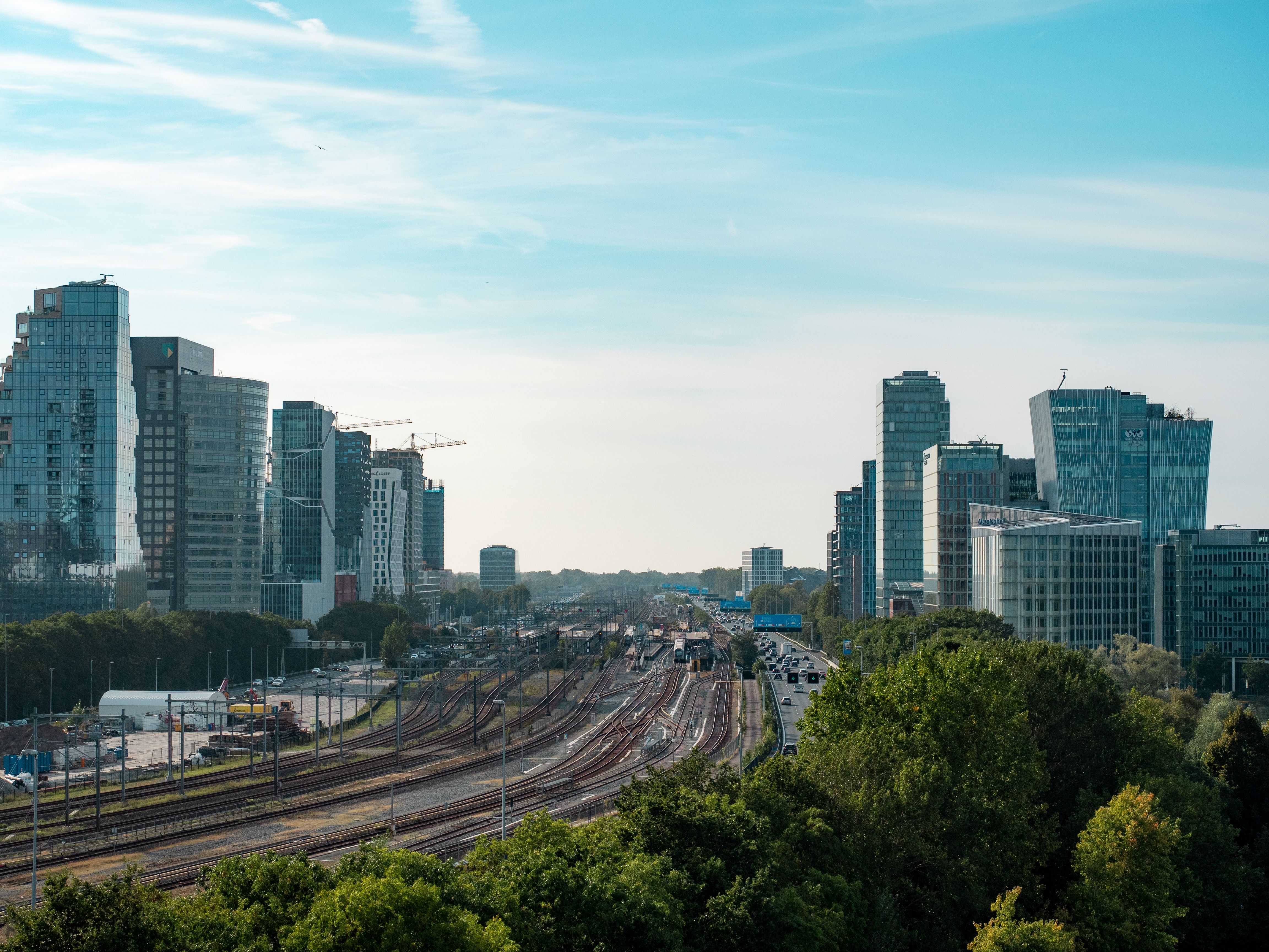 A view of a city with train tracks and buildings · Free Stock Photo
