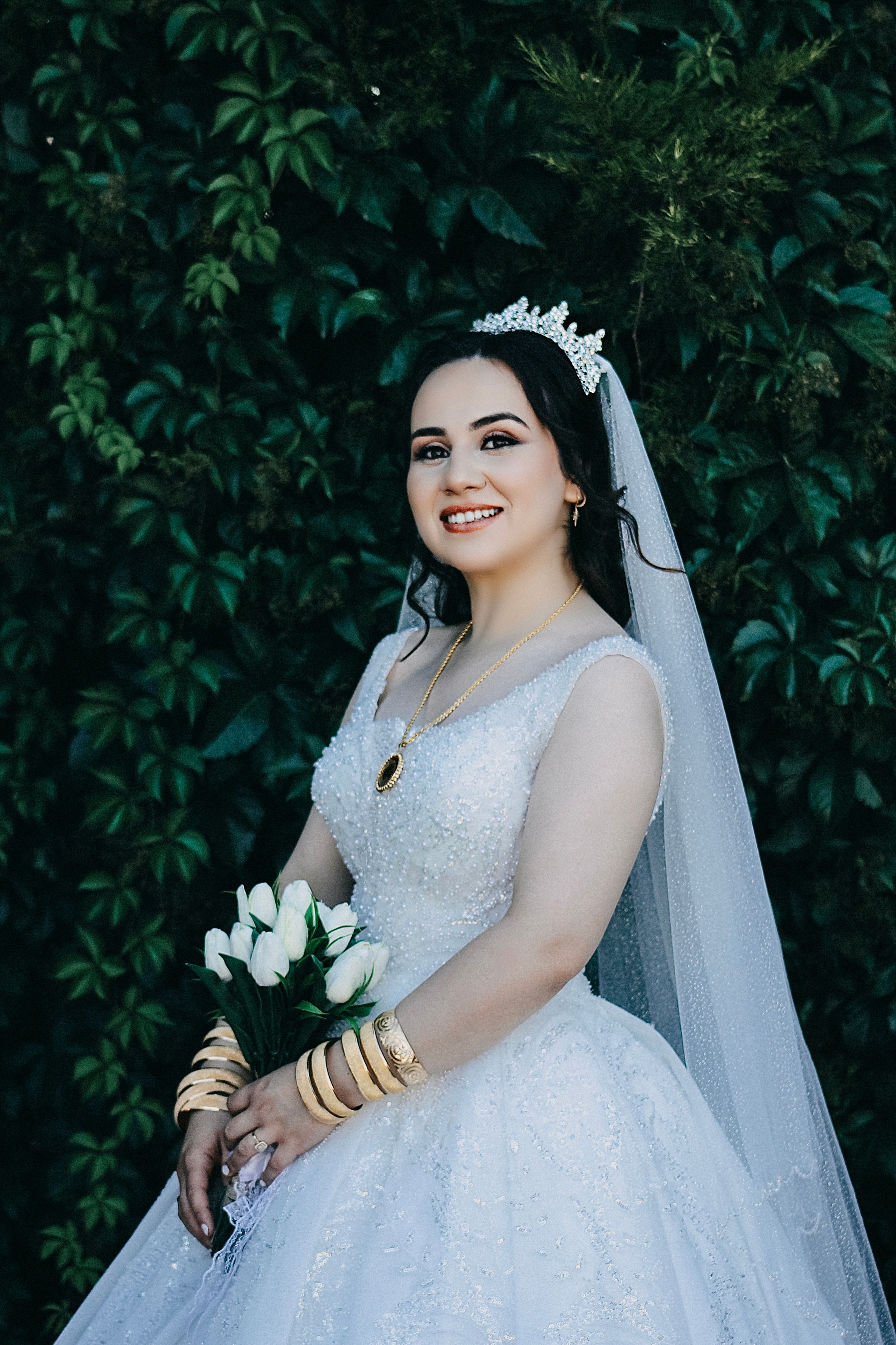 A bride in a white wedding dress poses for a photo · Free Stock Photo