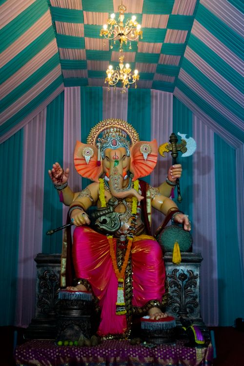 Free A vibrant statue of Lord Ganesha adorned in a traditional setup for Ganesh Chaturthi festival in Mumbai, India. Stock Photo