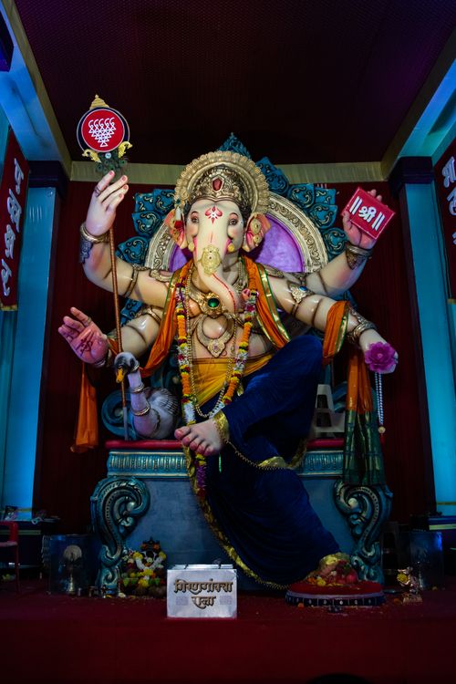 Free Colorful Ganesh idol adorned with decorations at a temple in Mumbai during Ganesh Chaturthi. Stock Photo
