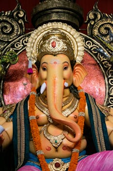 Ornate Ganesha statue showcasing traditional Indian arts and vibrant colors captured during Ganesh Chaturthi in Mumbai.