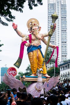 Colorful Ganesh idol procession during Ganesh Chaturthi festival in Mumbai, India.