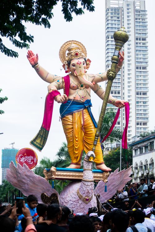 Free Colorful Ganesh idol procession during Ganesh Chaturthi festival in Mumbai, India. Stock Photo