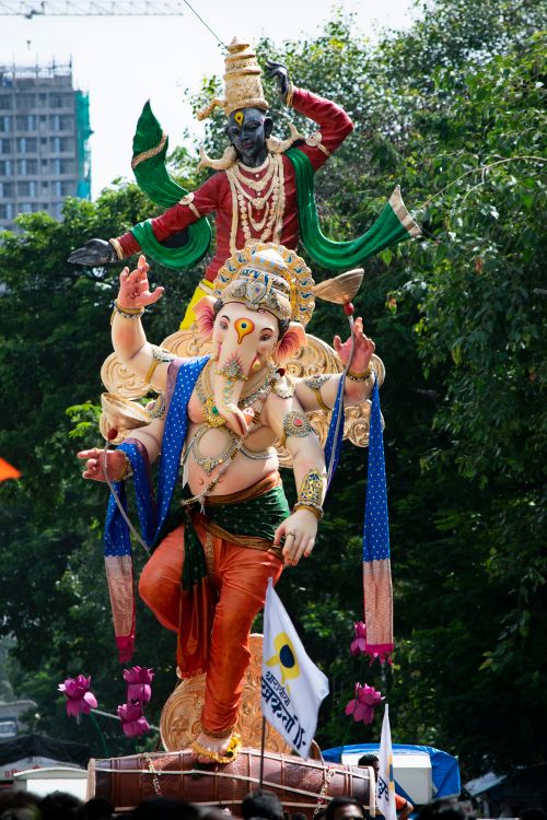 Free Vibrant Ganesh idol at Mumbai's Ganesh Chaturthi festival with traditional attire. Stock Photo