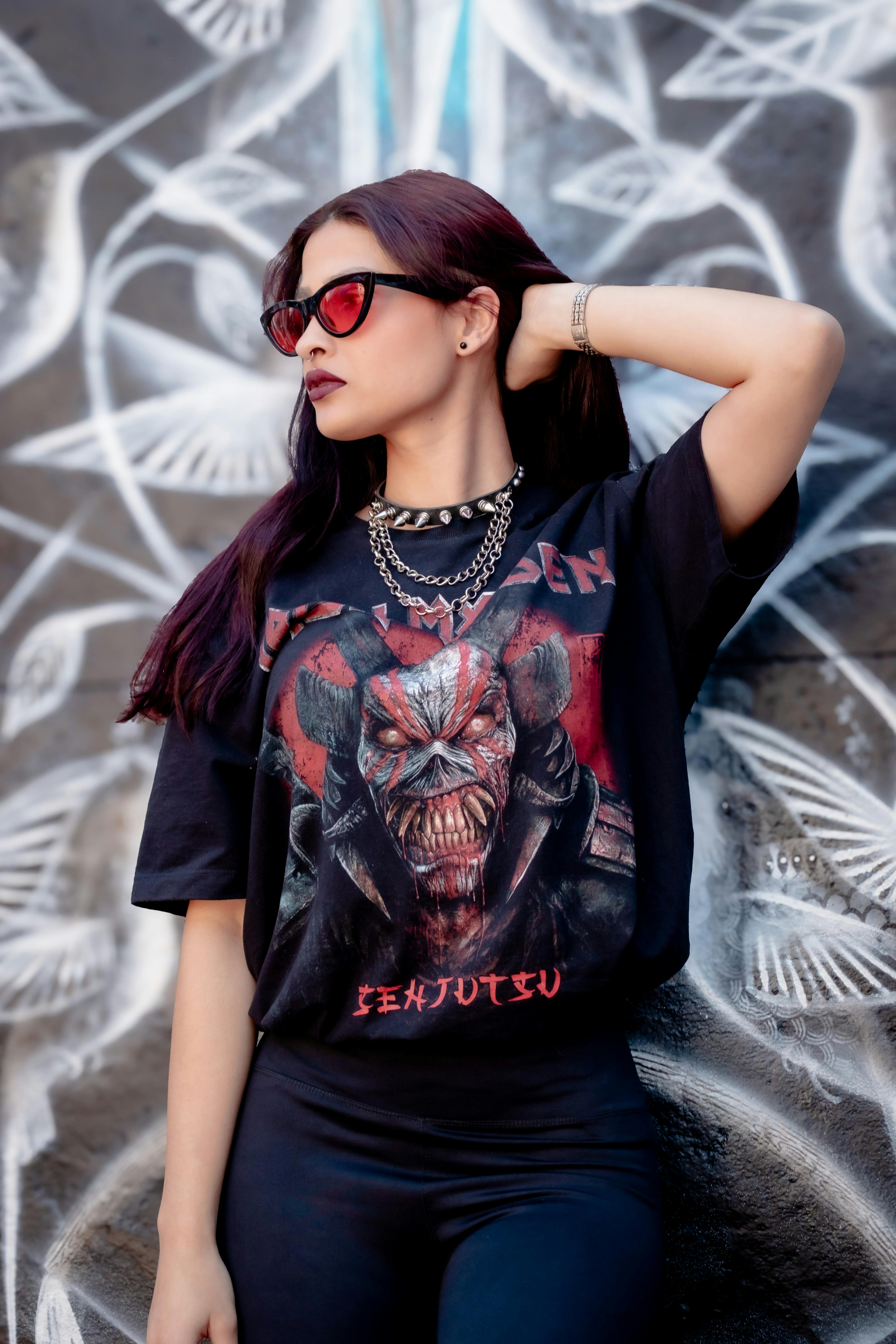 a woman wearing a t shirt with a skull on it