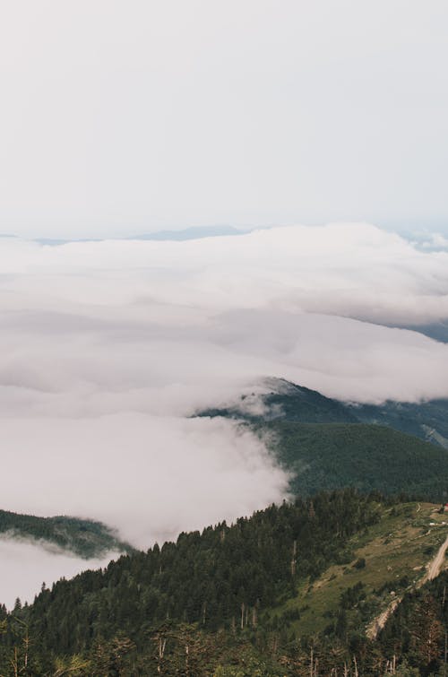 Bird's Eye View Of Mountains Covered With Clouds