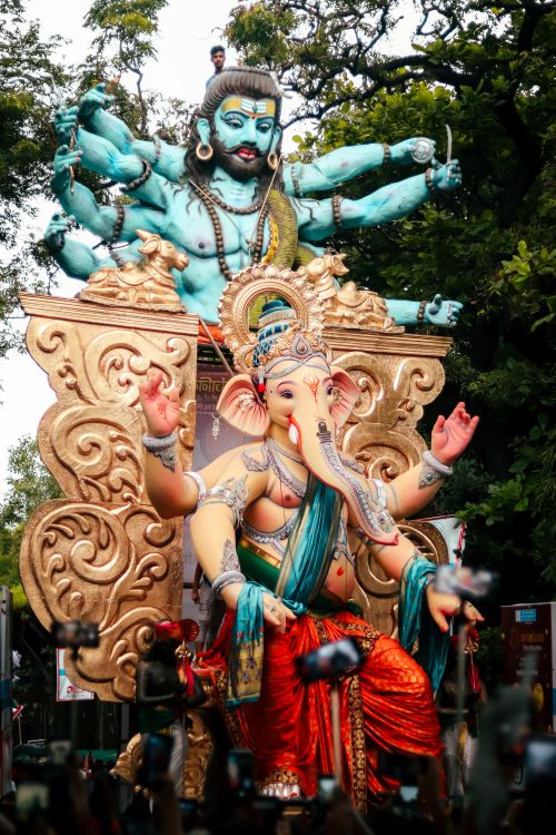 Free Intricate Ganesh statue during a colorful festival parade outdoors. Stock Photo