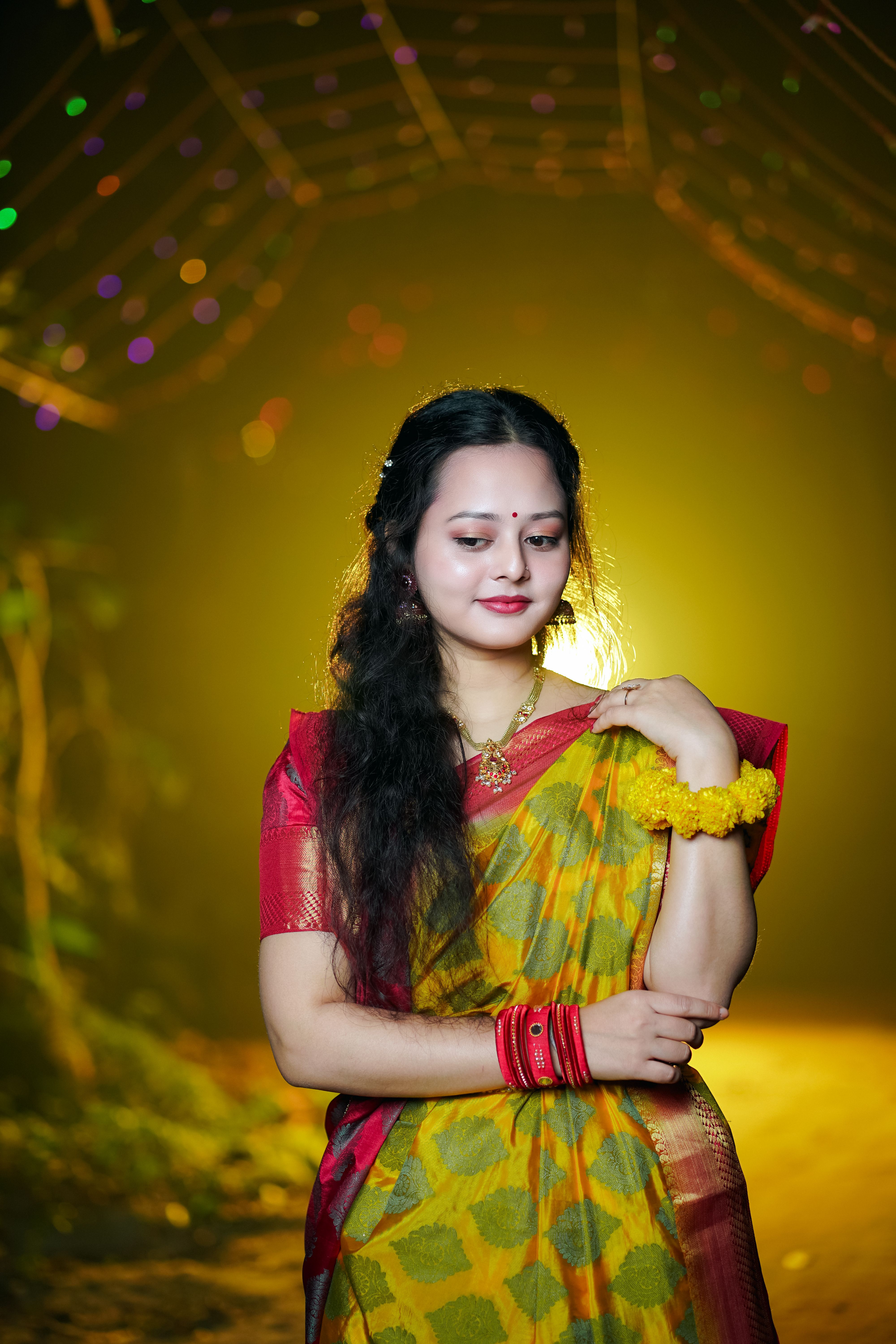 A young girl in a sari with her hair blowing in the wind · Free Stock Photo