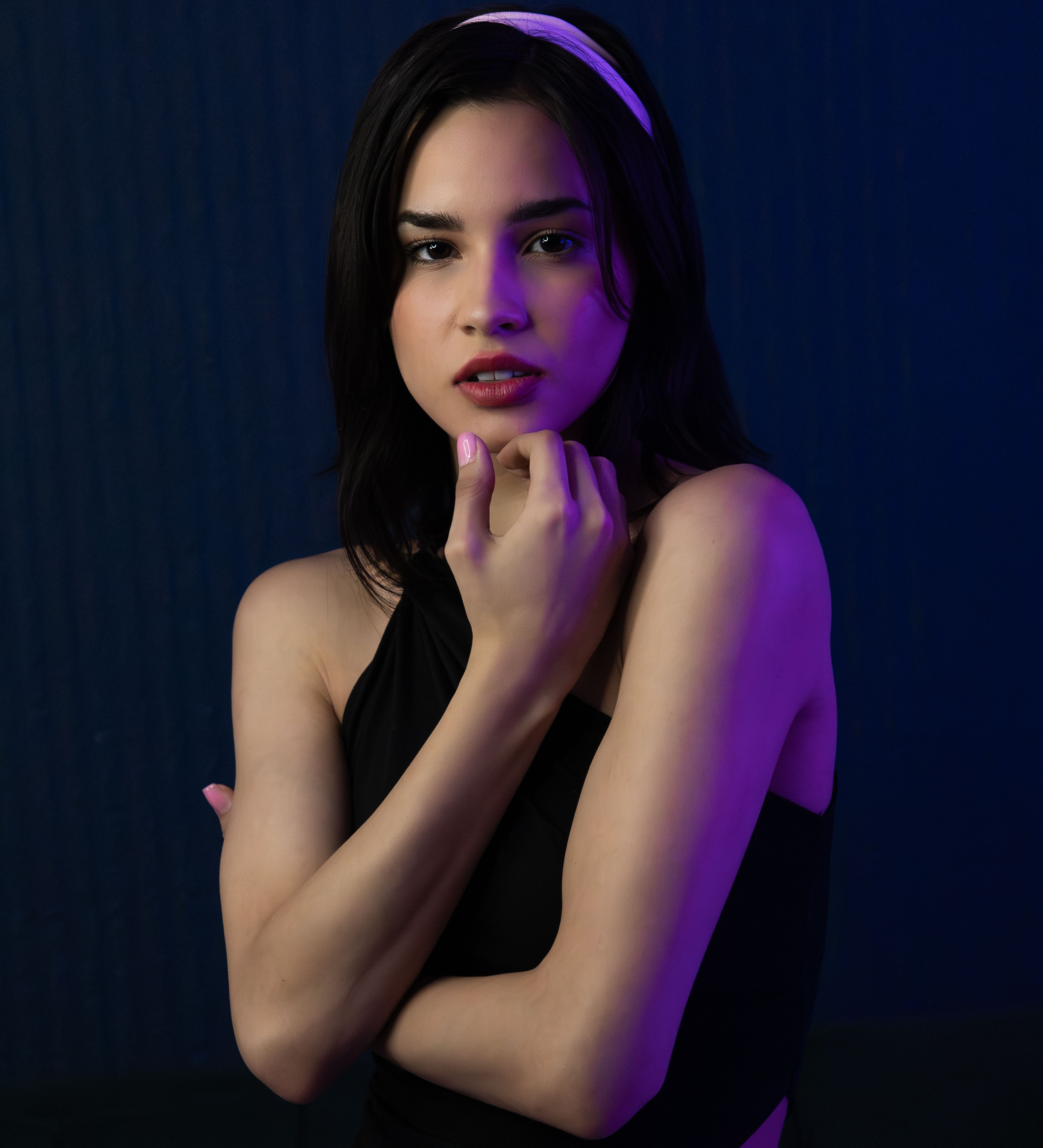 A woman in a black dress posing for a photo · Free Stock Photo