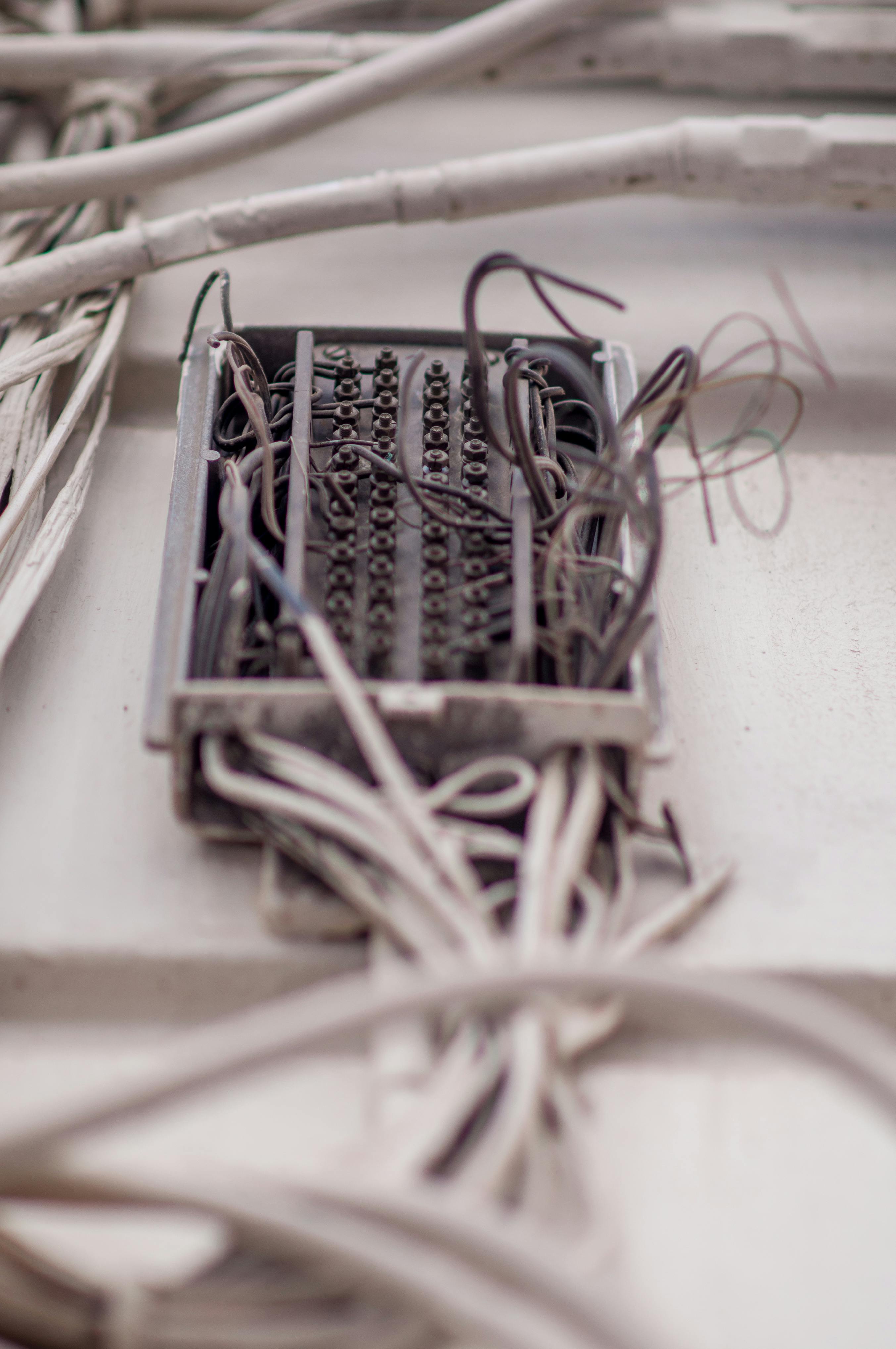 a close up of wires and wires in a wall