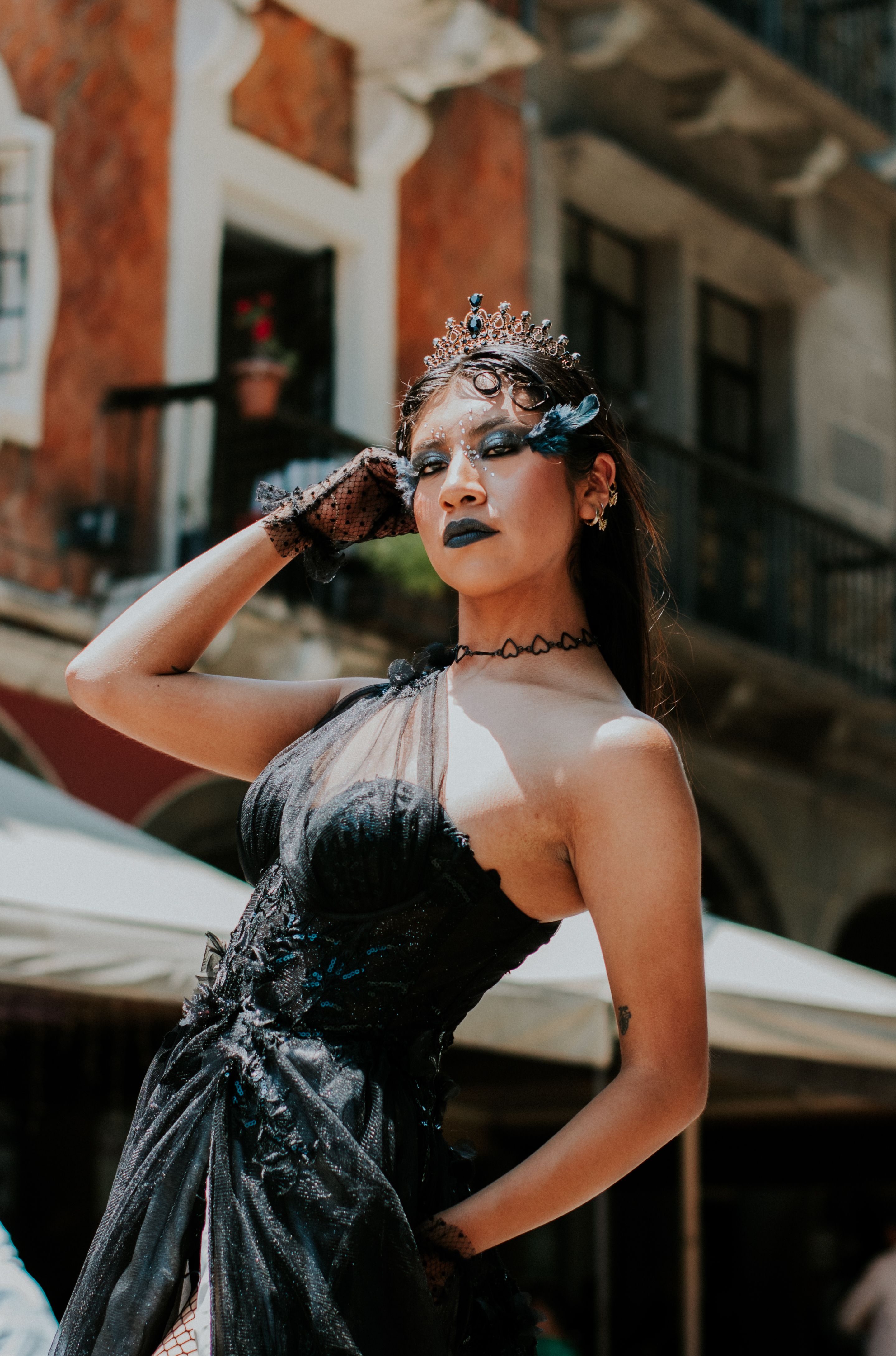 A woman in a black dress and black makeup · Free Stock Photo