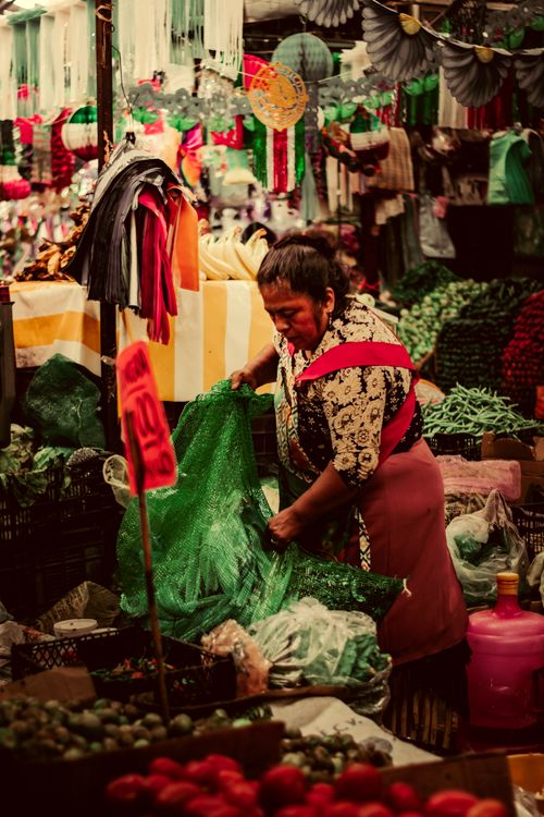 Free Vibrant market stall in Cholula, Mexico with merchant among colorful goods. Stock Photo