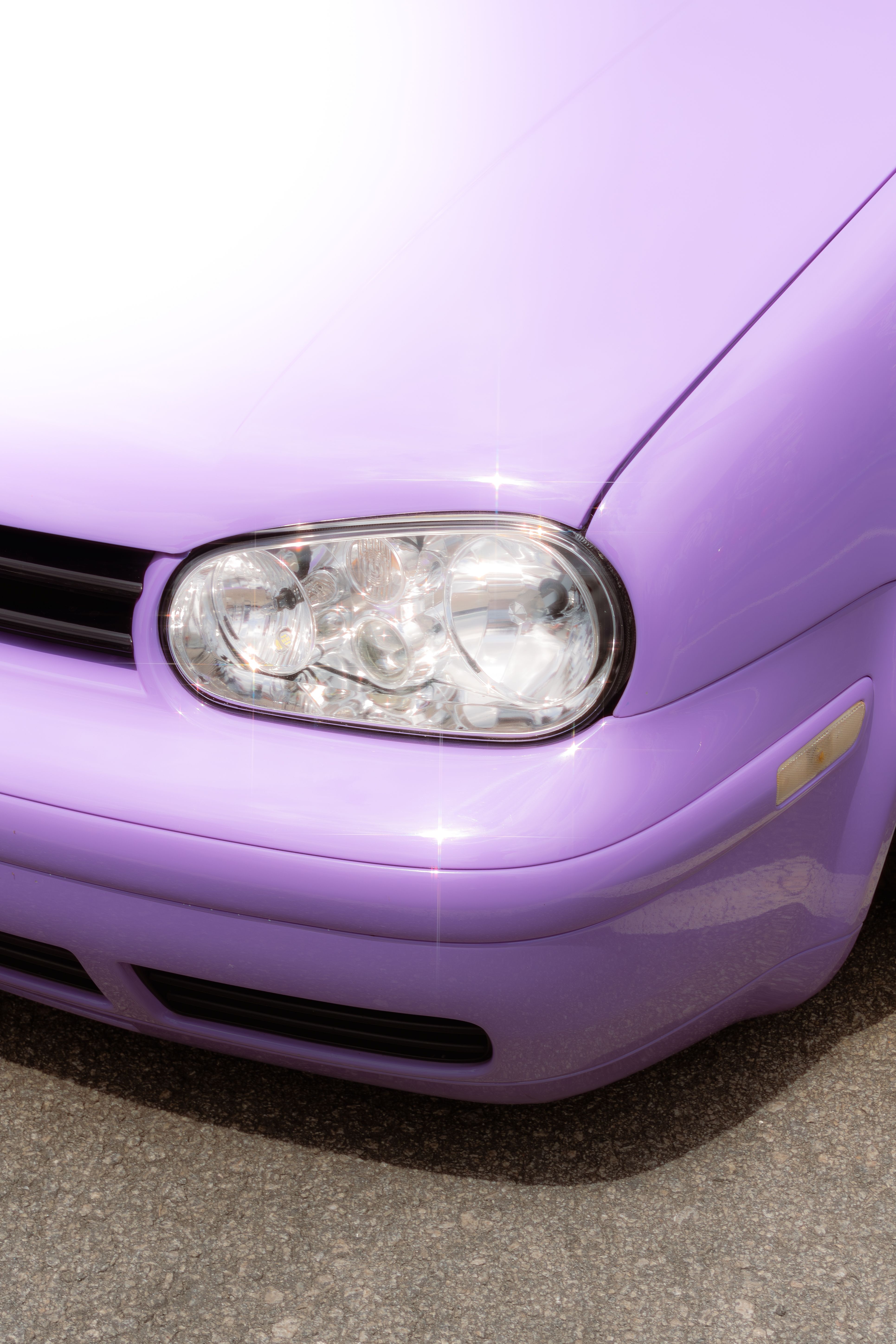 A close up of a purple vw golf · Free Stock Photo