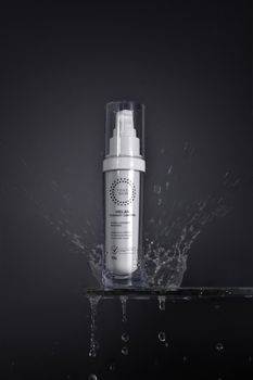 A sleek product bottle with a clean, modern design surrounded by dynamic water splash.
