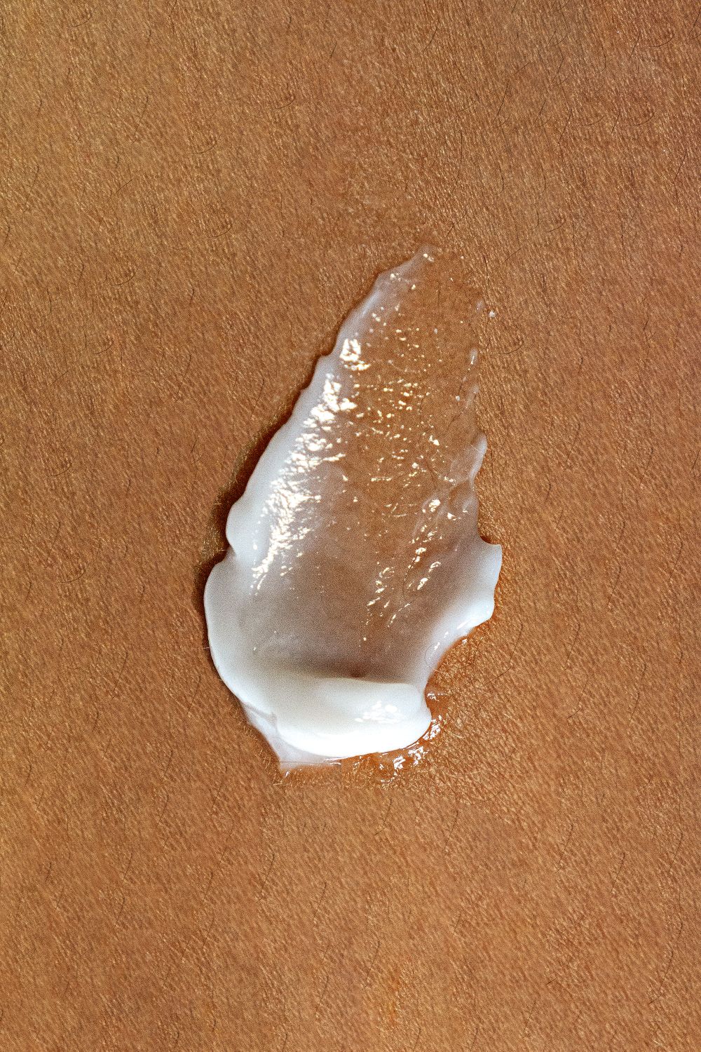 A swatch of the fluid on warm skin — photo by Ana Frontzek on Pexels