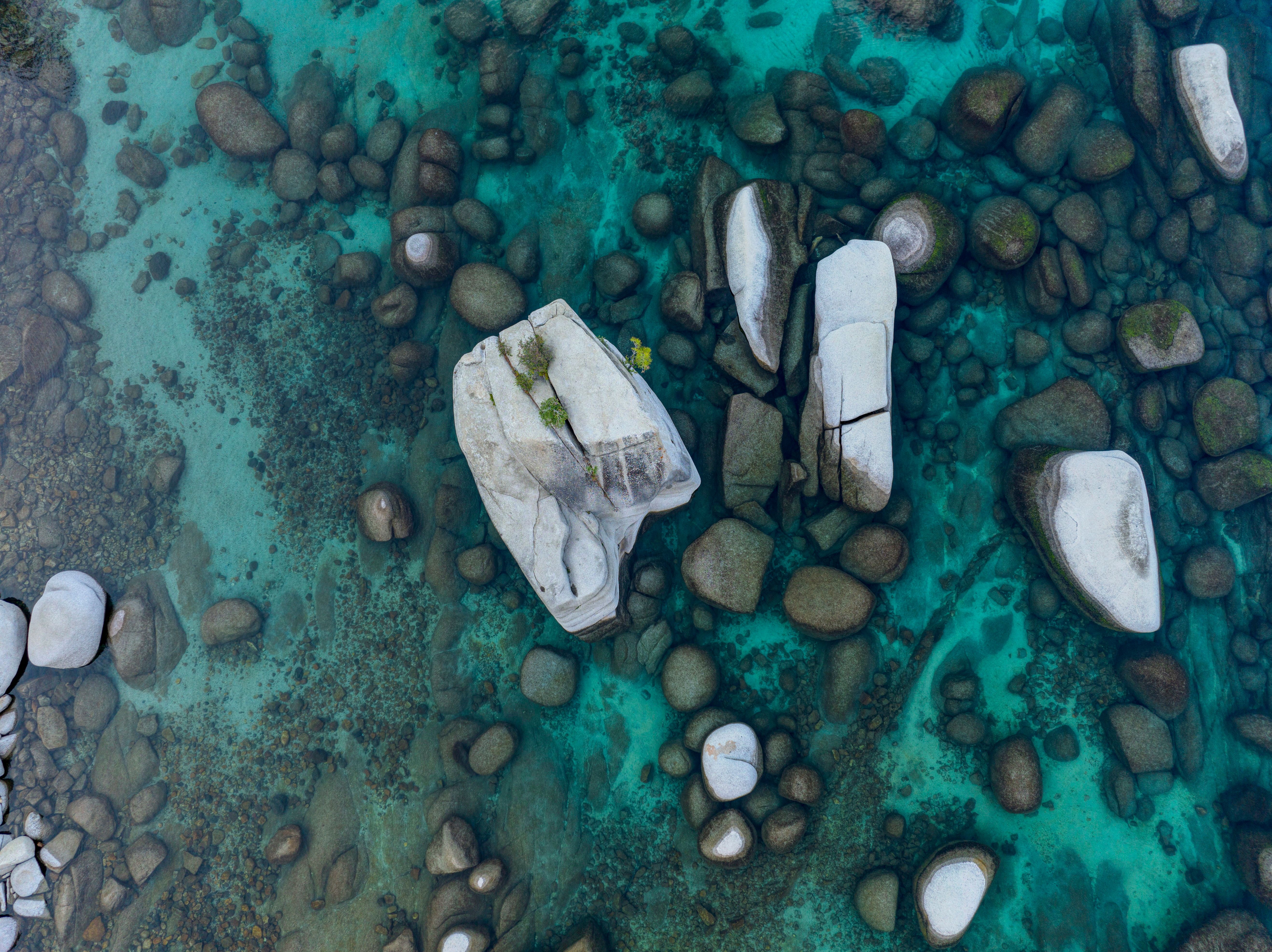 Aerial view of rocks and water in the ocean · Free Stock Photo