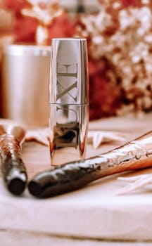 Stylish makeup arrangement featuring Luxe branded product and brushes.