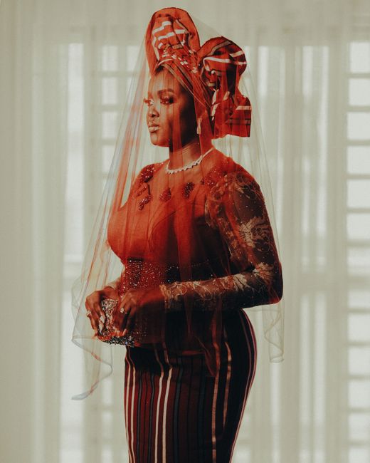Striking portrait of a woman wearing traditional Nigerian attire, showcasing elegance and cultural heritage.
