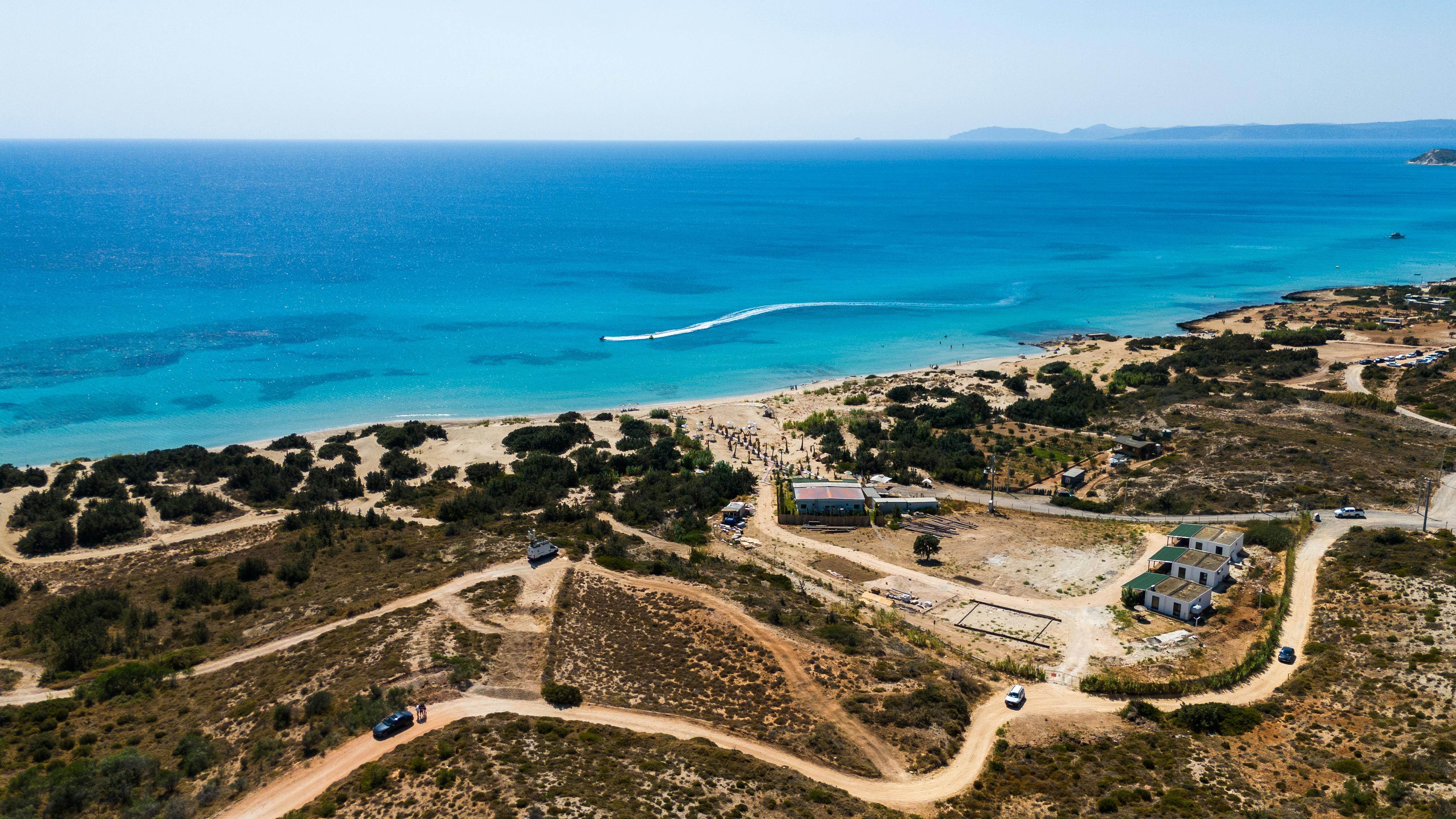 A breathtaking aerial shot of the pristine beach in Çeşme, showcasing the natural beauty of the Turkish coastline. - Photo by Yasin Koçtepe on Pexels