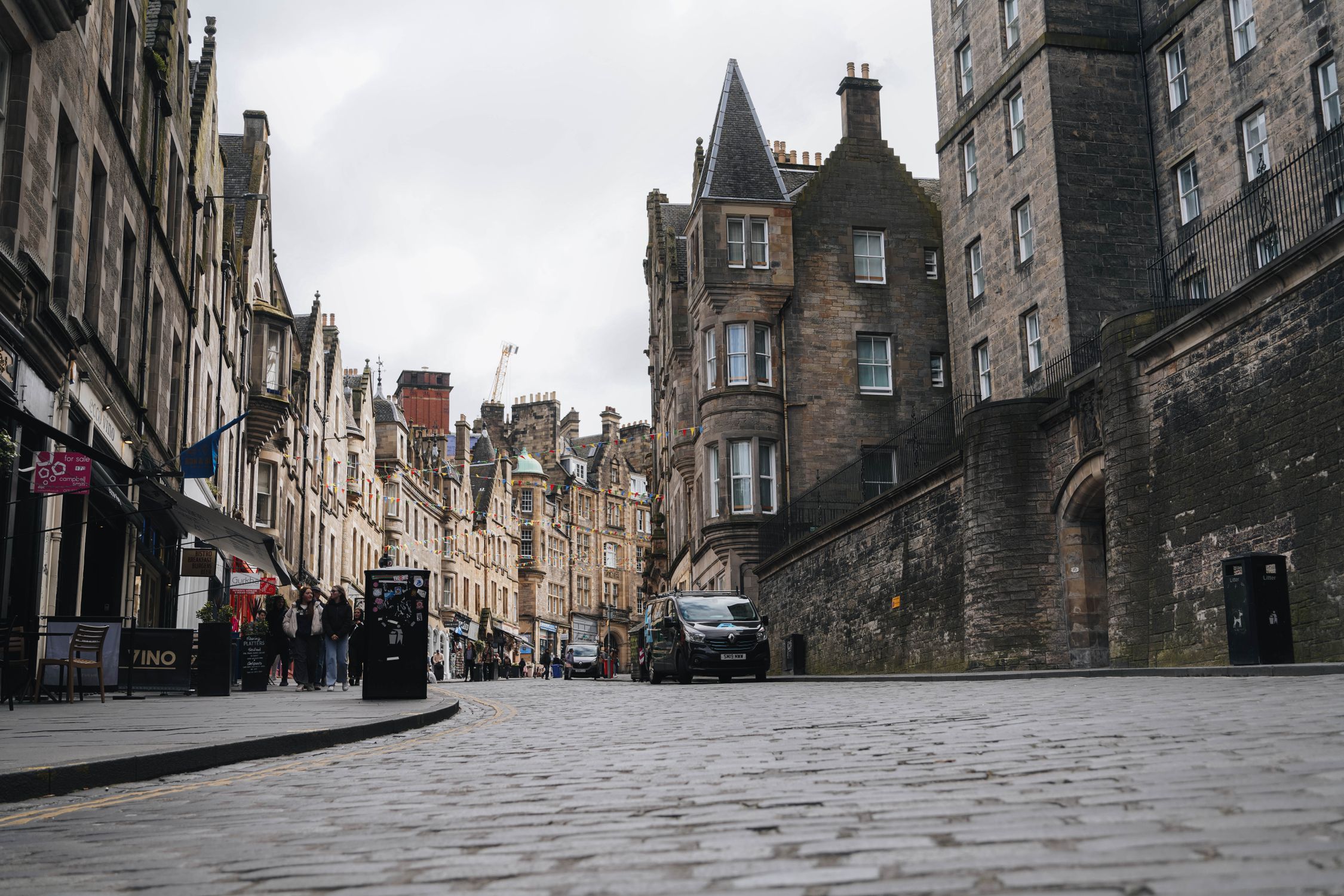 Explore the historic architecture and cobblestone streets of Edinburgh, Scotland, captured in this urban cityscape.