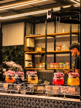 Diverse tea selection in a vibrant Kochi cafe, showcasing an urban and lively ambiance.